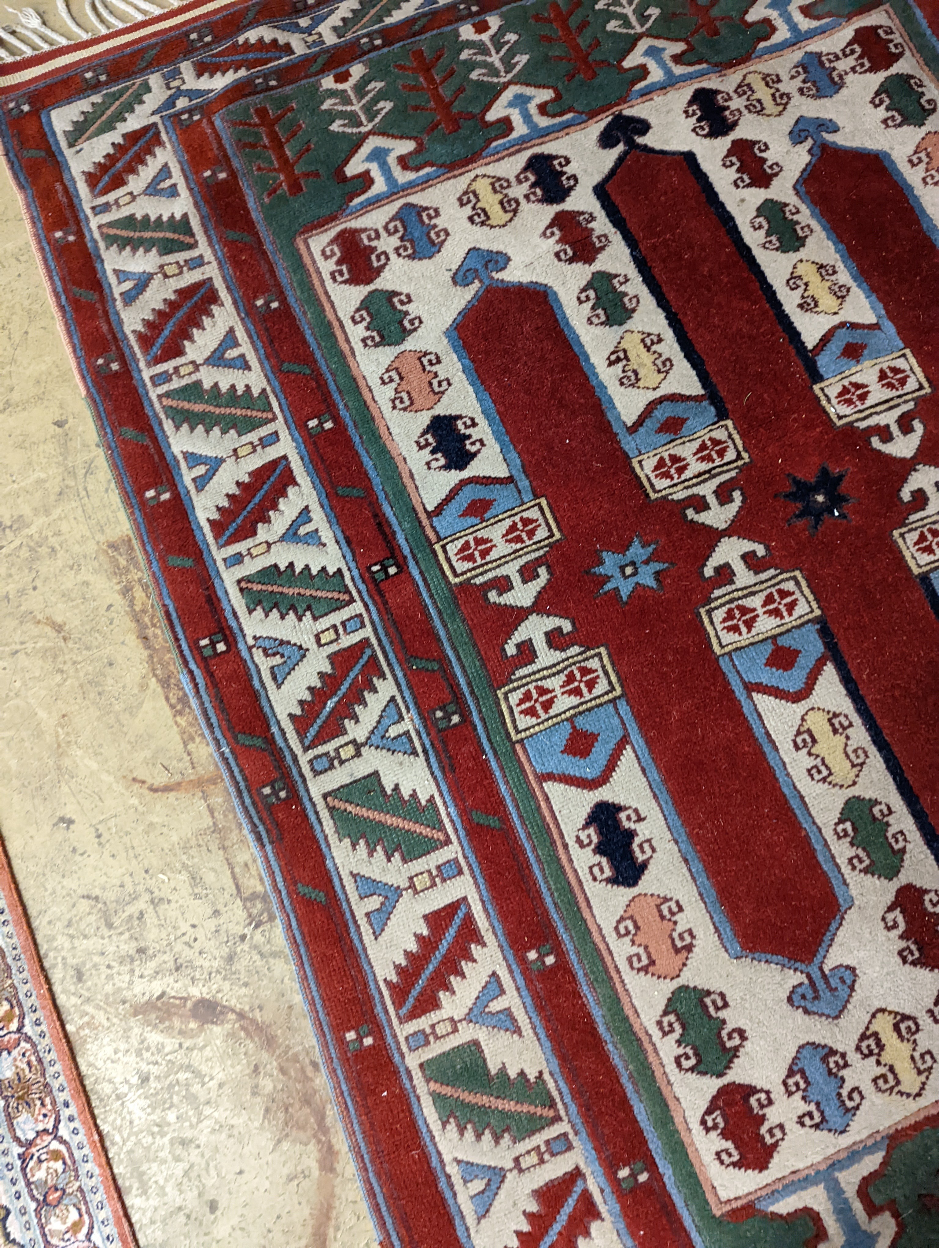 Two Turkish rugs and a Persian rugs. Largest, 284x172cm.